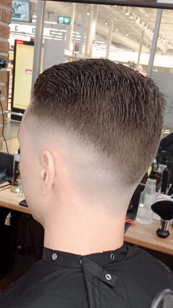 A clean high fade, finished at Sports Barber